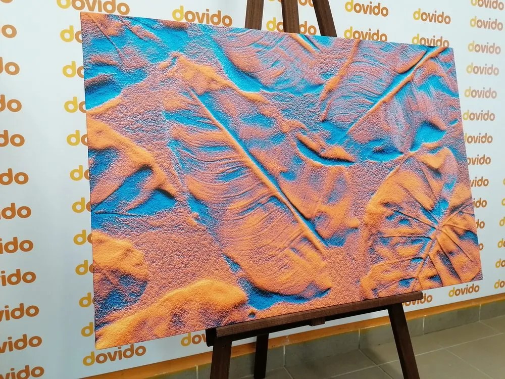 Quadro su tela – Texture di foglie sulla spiaggia di sabbia