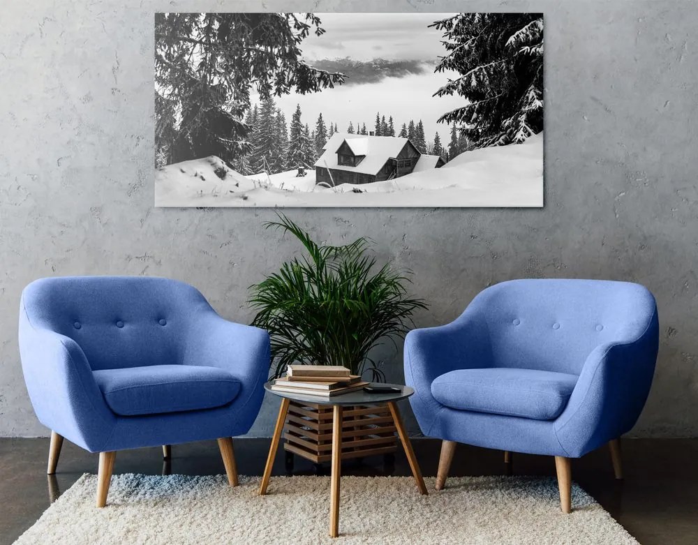 Quadro su tela – Casetta di legno tra pini innevati in bianco e nero