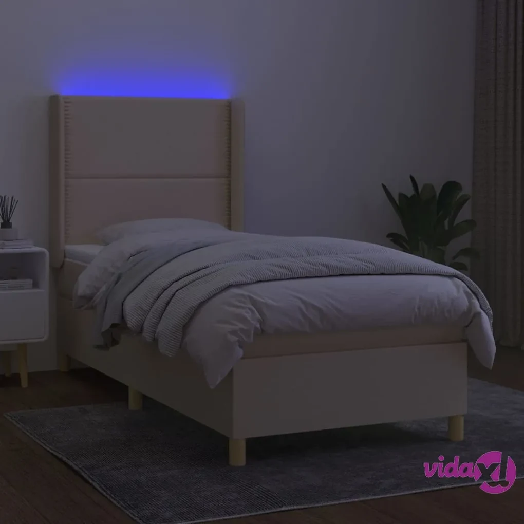 Letto a Molle con Materasso e LED Crema 90x190 cm in Tessuto