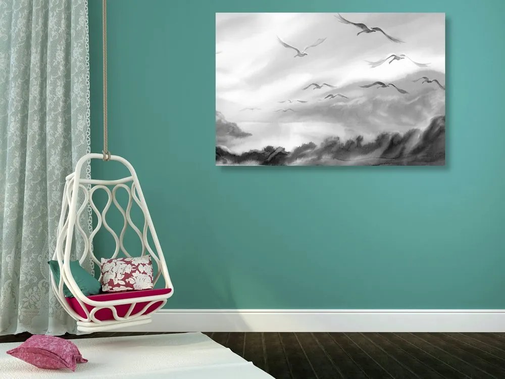 Quadro su tela – Volo di uccelli sopra il paesaggio in bianco e nero
