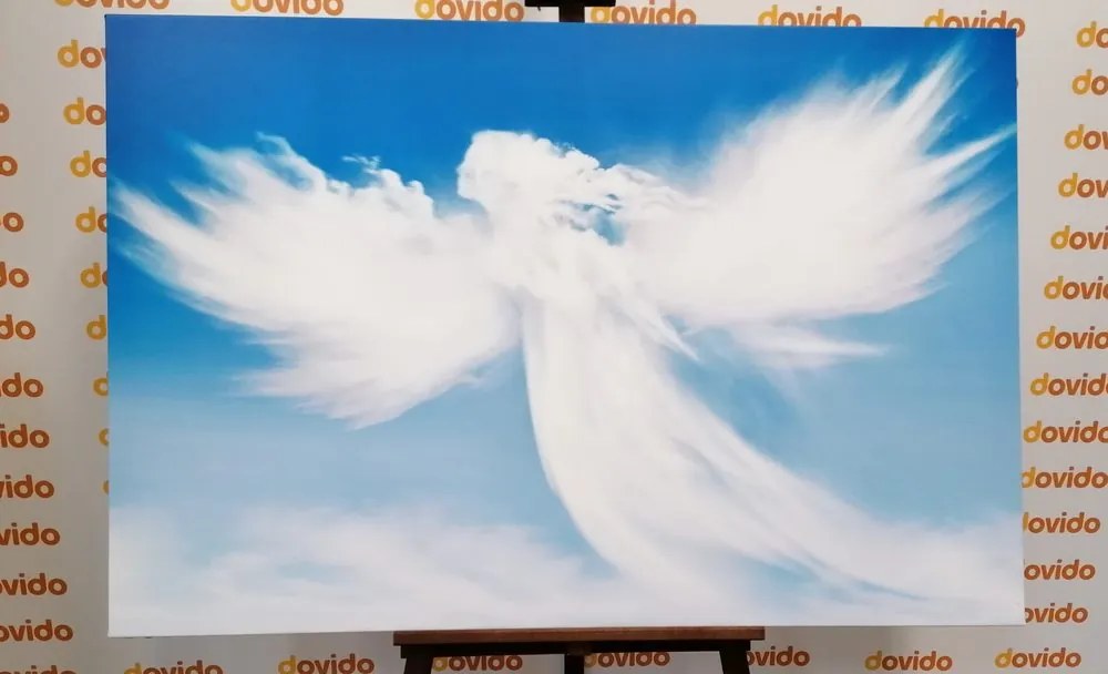 Quadro su tela – Figura d'angelo tra le nuvole
