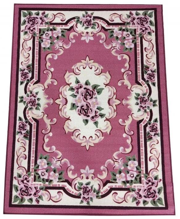 Bellissimo tappeto rosa con motivo floreale