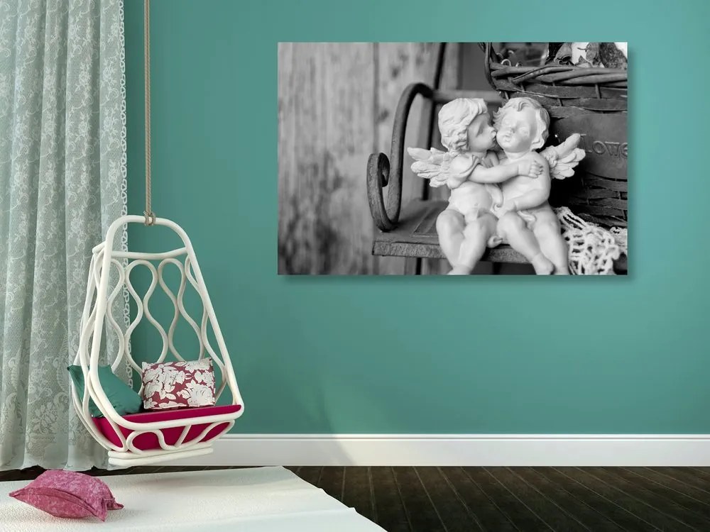 Quadro su tela – Statuette di angioletti sulla panchina in bianco e nero