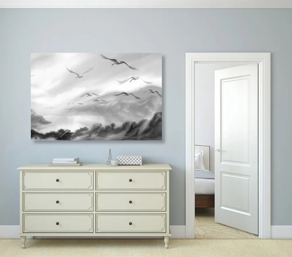 Quadro su tela – Volo di uccelli sopra il paesaggio in bianco e nero