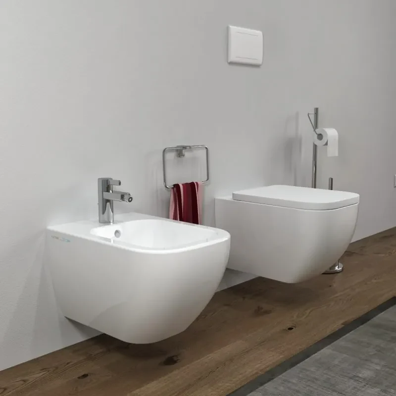 Bidet e Vaso WC sospesi Legend filo muro in ceramica completo di sedile  softclose - Incluse,Con Brida