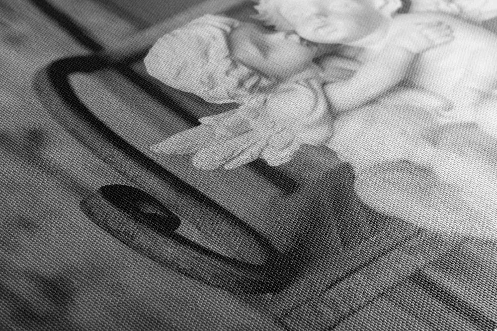 Quadro su tela – Statuette di angioletti sulla panchina in bianco e nero