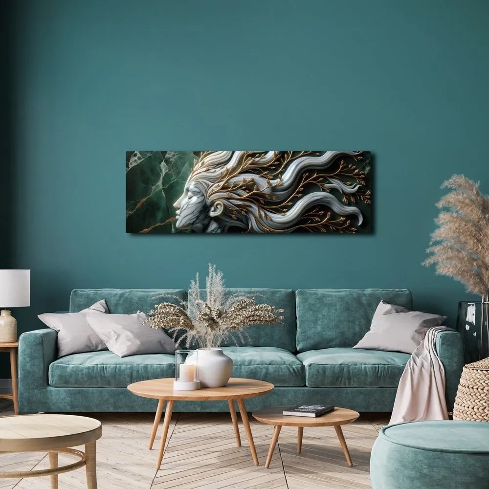 Quadro su tela – Donna unita alla natura con foglie dorate