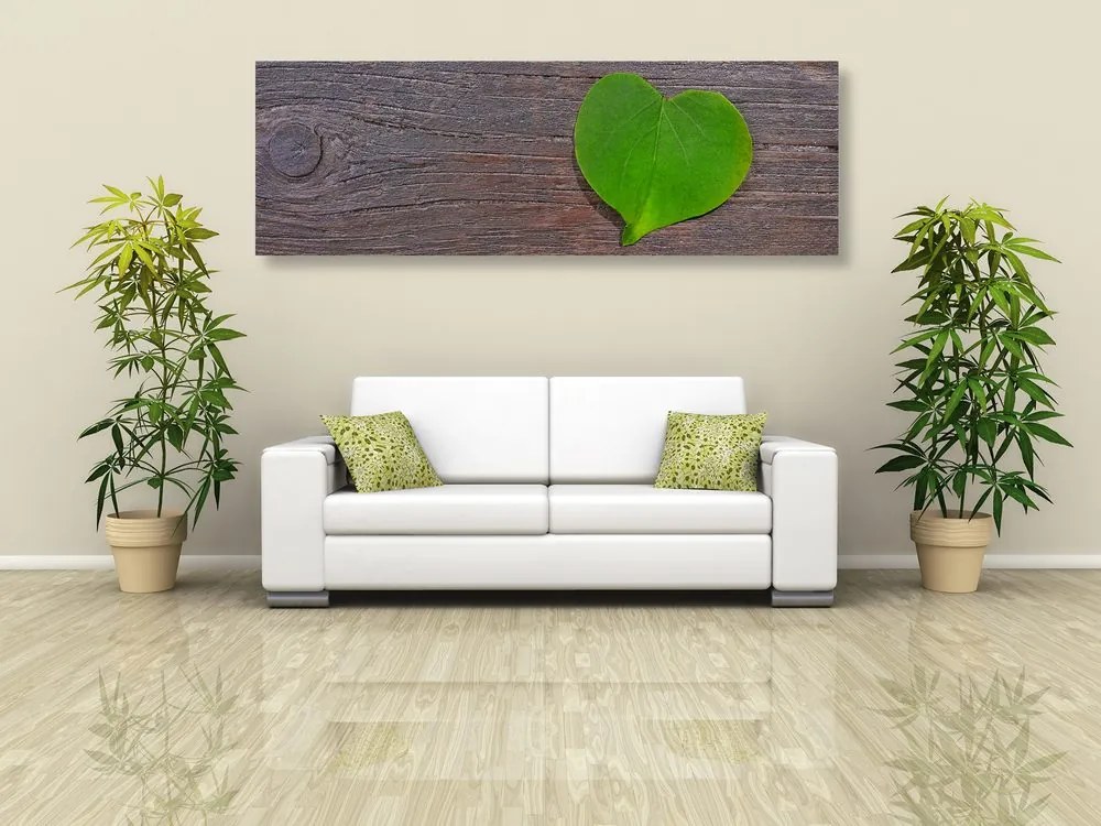 Stampa su tela – Foglia a forma di cuore su sfondo di legno