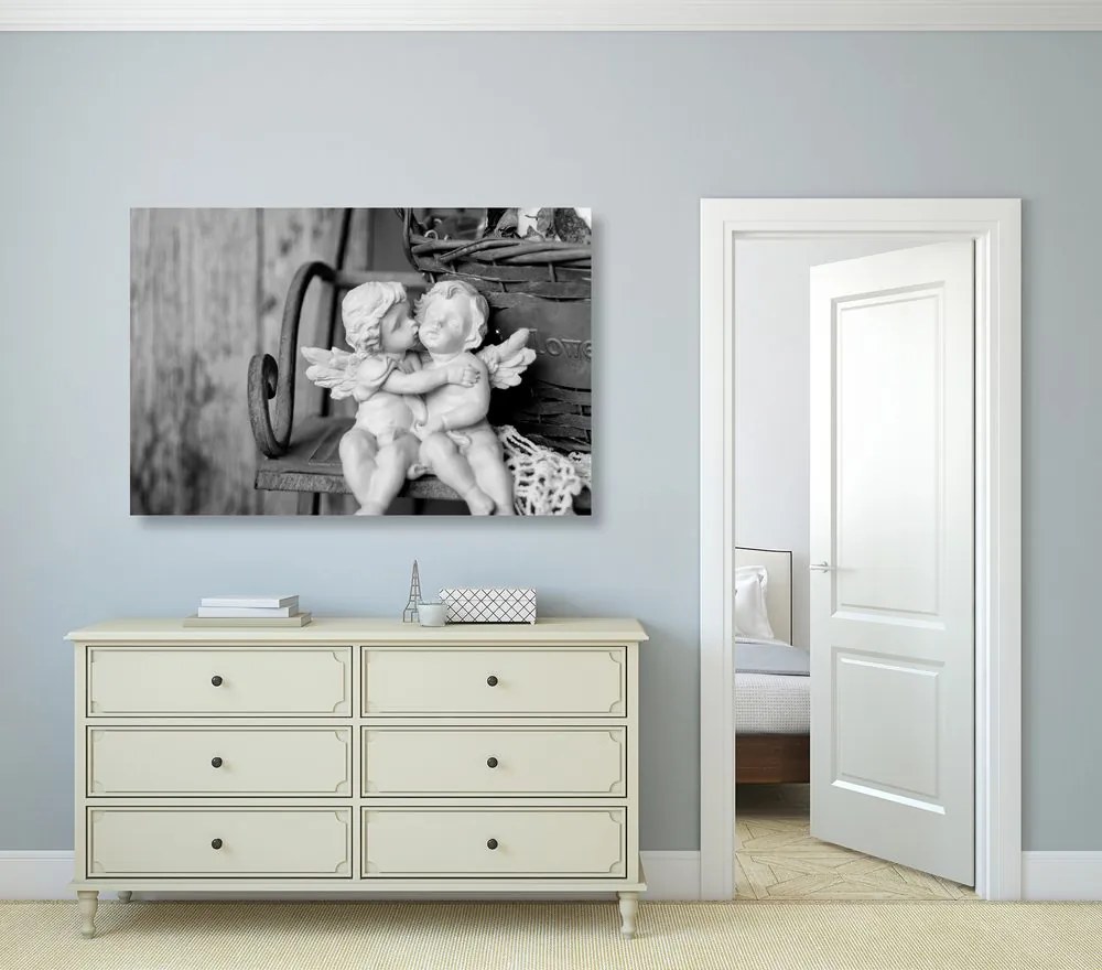 Quadro su tela – Statuette di angioletti sulla panchina in bianco e nero