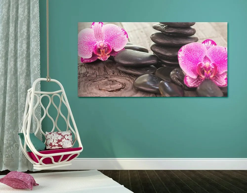 Quadro su tela – Orchidea e pietre Zen su sfondo in legno