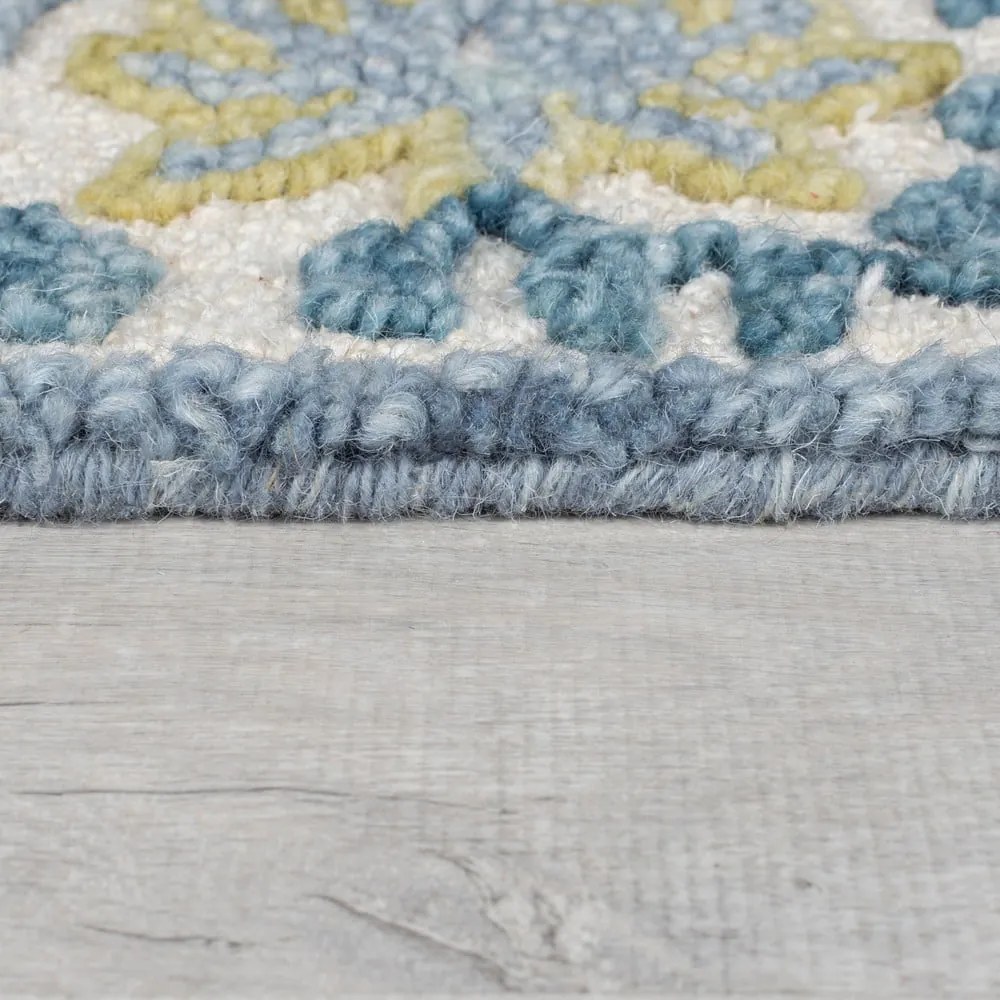 Tappeto blu/avorio in misto lana tessuto a mano 120x170 cm Myla Floral Frame – Flair Rugs