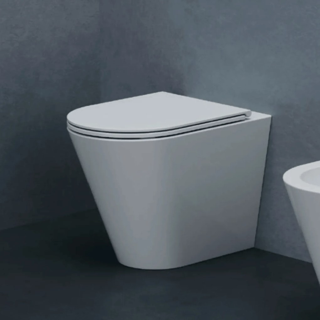 Wc a Terra Senza Brida Azzurra Ceramica Filo Muro Bianco Lucido "Forma"