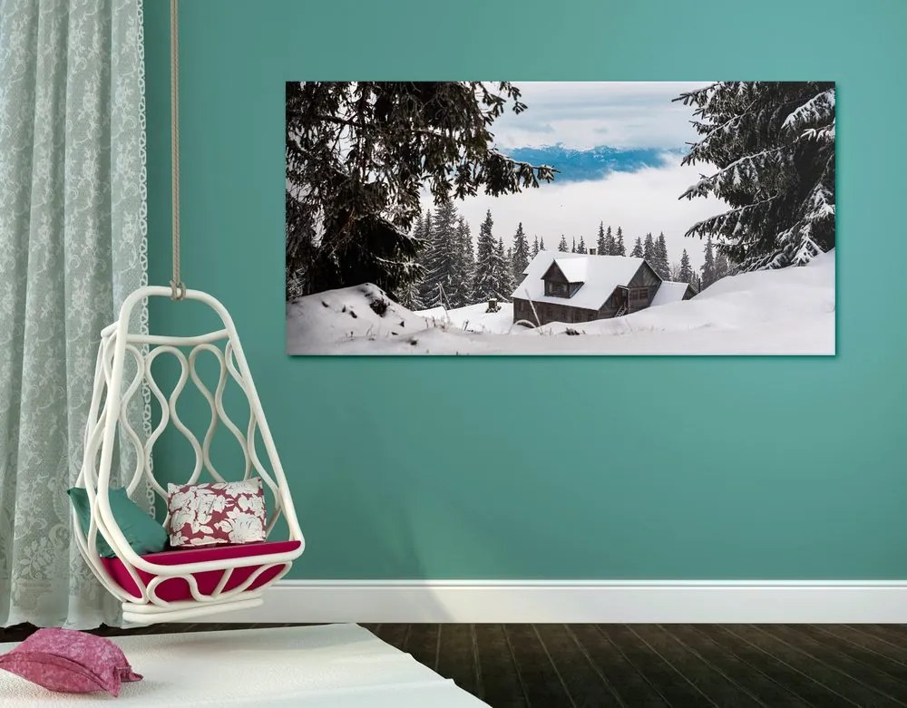 Stampa su tela – Casetta di legno tra pini innevati