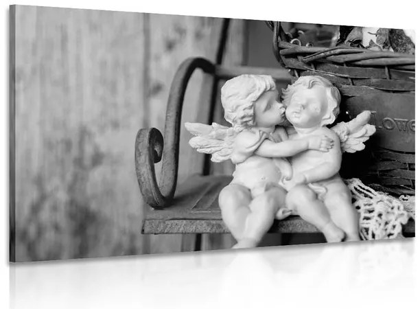 Quadro su tela – Statuette di angioletti sulla panchina in bianco e nero