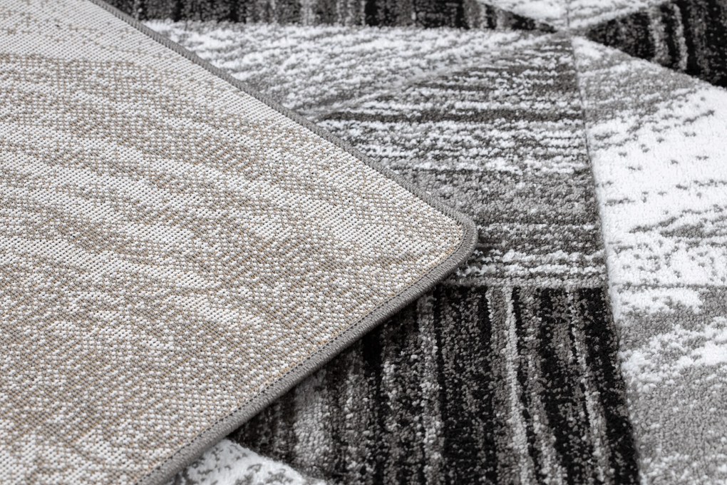 Tappeto ALTER Nano triangoli grigio