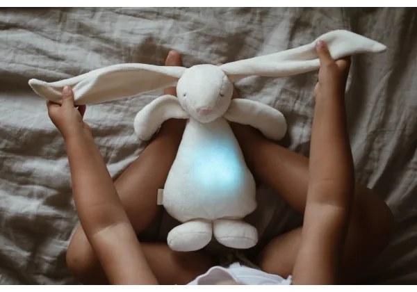 Moonie - Amico di coccole con una melodia e luce coniglietto crema