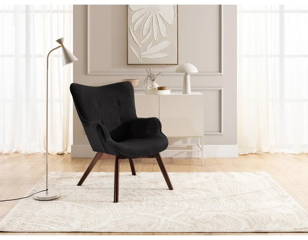 Poltrona con poggiapiedi nera con rivestimento in velluto a coste Niko – Ropez