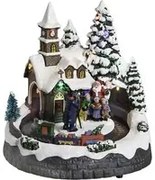 Chiesa, villaggio di Natale con luci