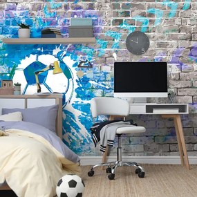 Carta da parati – Palla da Calcio Blu su Muro di Mattoni