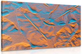 Quadro su tela – Texture di foglie sulla spiaggia di sabbia