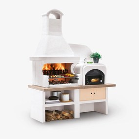 Palazzetti Malibù 2 barbecue a legna con forno pizza a destra e Piano in Marmotech effetto granito rosso