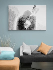 Quadro su tela – Coppia innamorata sotto il vischio in bianco e nero