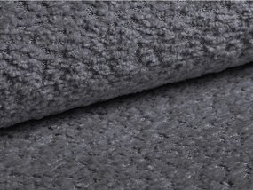 Divano grigio scuro allungabile con rivestimento in bouclé 206 cm Kemi – Cosmopolitan Design