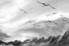Quadro su tela – Volo di uccelli sopra il paesaggio in bianco e nero