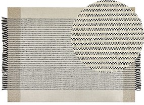 Tappeto lana beige chiaro e nero 140 x 200 cm DIVARLI Beliani