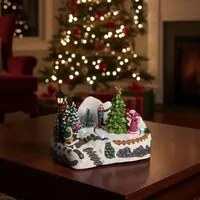 Albero con bambini, villaggio di Natale con luci