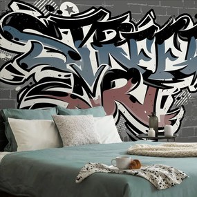 Carta da parati – Imitazione mattoni con scritta Street Art