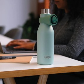 Bottiglia da viaggio in acciaio inox color menta 500 ml Loop - Joseph Joseph