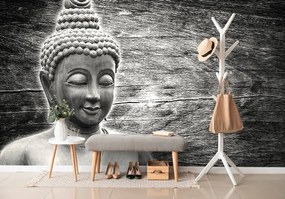 Carta da parati – Statua di Buddha bianco e nero su sfondo di legno