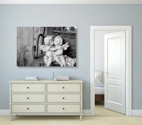 Quadro su tela – Statuette di angioletti sulla panchina in bianco e nero