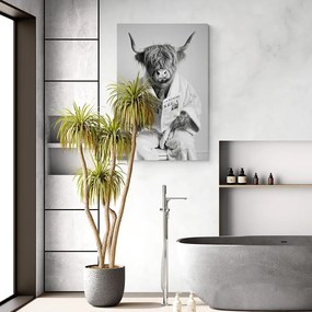 Quadro su tela – Mucca con giornali in bagno