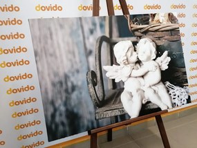 Stampa su tela – Statuette di angioletti sulla panchina
