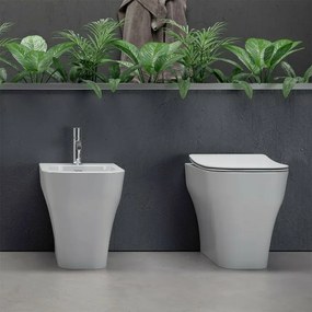 Sanitari filo muro traslati Olympia serie Synthesis con copriwater rallentato