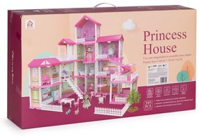 Una grande casa delle bambole con mobili da giardino