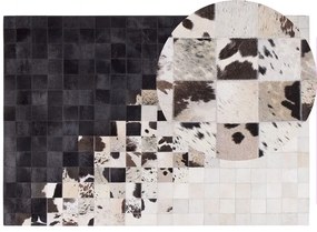 Tappeto in pelle color bianco e nero 140 x 200 cm KEMAH Beliani