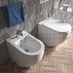 Linea Zeta coppia sanitari vaso rimless e bidet a pavimento filo parete con sedile rallentato bianco lucido