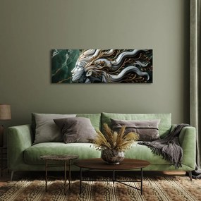 Quadro su tela – Donna unita alla natura con foglie dorate