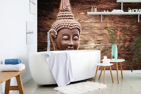 Carta da parati – Statua di Buddha su sfondo di legno