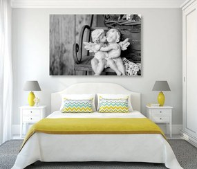Quadro su tela – Statuette di angioletti sulla panchina in bianco e nero
